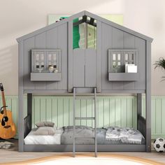 there is a bunk bed with a house on top and a guitar in the corner