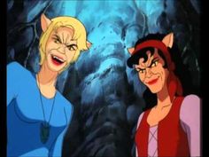 two animated women standing next to each other in front of a cave with an evil cat on its head