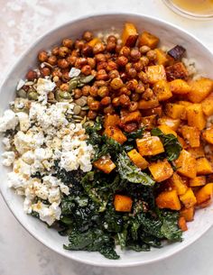 a white bowl filled with different types of food