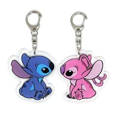 two key chains with stitch and stitch characters on them, one is pink and the other is blue