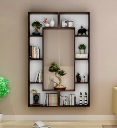 a living room filled with furniture and a large mirror on the wall over a book shelf