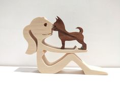 a wooden sculpture of a dog on a white background