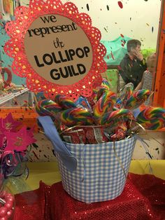 a basket filled with lollipops sitting on top of a table