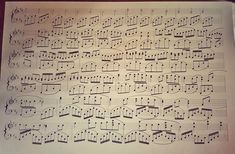 sheet music with musical notations on it and some lines in the middle, all lined up