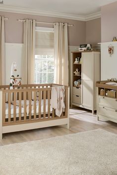 a baby's room with a crib, dresser and bed