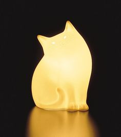 a yellow cat light sitting on top of a table