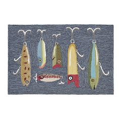 several different types of fishing lures hanging from hooks on a blue background with white string