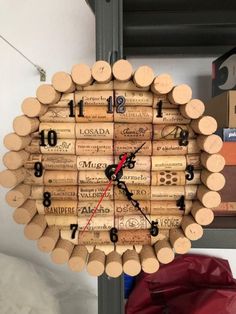 a clock made out of wine corks on a shelf