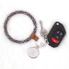 a keychain with a personal monogrammed tag and a car key on it