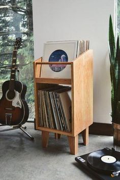 an old record player and guitar are on display