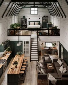 an open floor plan with stairs leading up to the second story and loft above it