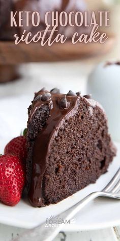 a piece of chocolate cake on a white plate with strawberries next to it and the words, keto chocolate ricotta cake