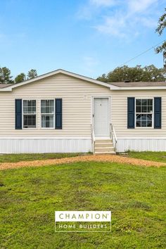 a small house with the words champion home builder's written in front of it