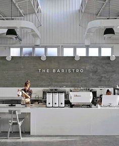 the interior of an industrial kitchen with white appliances