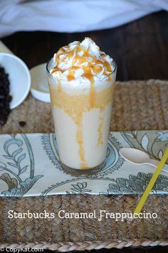 there is a drink with whipped cream and caramel on top