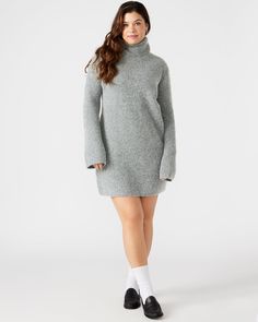 The ABBIE sweater dress is expertly crafted with a turtleneck and flare sleeves and offers a relaxed yet stylish fit. The soft brushed material provides warmth and comfort, making it the perfect mini dress for cooler weather. Elevate your wardrobe with this versatile and chic pullover dress. Mini sweater dress Turtleneck pullover style Flared long sleeves 98% polyester 2% elastane Hand wash Carla is 5ft 9in and is wearing a size large Lilia is 5ft 9in and is wearing a size small Imported Ribbed Turtleneck Mini Dress For Fall, Fall Ribbed Turtleneck Mini Dress, Cozy Mini Dress For Winter, Cozy Winter Mini Dress, Winter Mini Sweater Dress For Loungewear, Casual High Neck Mini Dress For Winter, Cozy High Neck Sweater Dress For Fall, Cozy High Neck Sweater Dress For Winter, Cozy Turtleneck Dresses For Winter