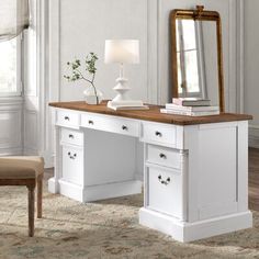 a white desk with drawers and a mirror