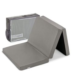 an open gray case sitting on top of a white surface