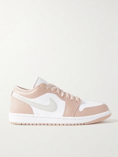 Nike's 'Air Jordan 1 Low' sneakers have been a firm favorite since they launched in 1985 - a testament to their timeless staying power. This pair is made from panels of leather in a soft colorway. The heel tab is embroidered with a signature winged logo.