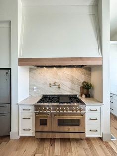 a stove top oven sitting inside of a kitchen