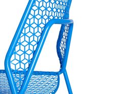 a blue chair that is sitting in the middle of some sort of structure on a white background