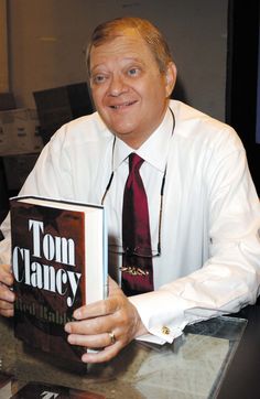 a man sitting at a table with a book in front of him and the title tom craney written on it