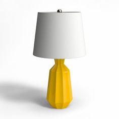 a yellow table lamp with a white shade on the base and a light in the middle