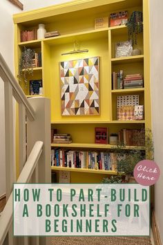 a bookshelf with yellow painted shelves and white stair railings in front of it