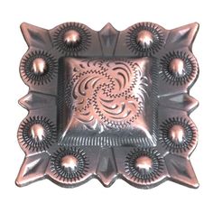 a decorative metal plate with an intricate design on the front and center, set against a white background