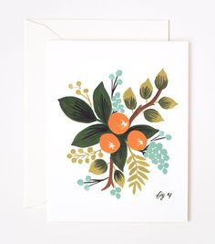 a card with an oranges and leaves on it