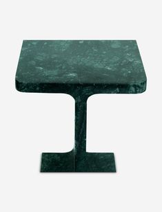 a green marble side table with a black base and square shaped top, on a white background