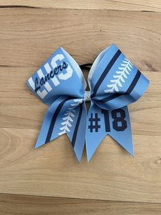 "3\" x 28 \" grosgrain ribbon with sublimation print and ponytail elastic attached. Finished product 7\" wide by 7\" tall.  \"Price per bow\" All bows are customizable: we can do it in your colors, with your team name/ mascot/logo in YOUR budget, Just message me for information on how to place your custom order.  Materials and fabrics can be substituted. We do not warranty hair elastics as they are not manufactured by us. All custom orders and bows with names/initials/monograms etc are custom ma Softball Hair Bows, Volleyball Bows, Softball Hair, Competition Bows, Softball Bow, Custom Cheer Bows, Softball Bows, Glitter Cheer Bow, Softball Hairstyles