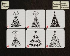 four playing cards with christmas trees and stars on them, all in different shapes and sizes