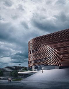 a building with wooden slats on the side and people walking around in front of it