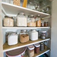 the pantry is stocked with many different types of foods and spices, including cereals