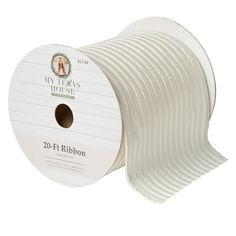 a spool of white ribbon on a roll