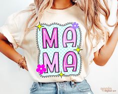 a woman wearing a t - shirt with the word ma ma on it and flowers