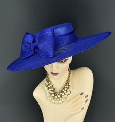 Note: The design of this hat, particularly the shallower crown, was crafted to create a unique aesthetic that suits some individuals perfectly. However, if you notice that the hat tends to slip, I would advise attaching an elastic strap to ensure a more secure and comfortable fit. ✿*.Key Features.*✿ This is a wide flat brim hat!! It's made of sinamay (3 layers ) and satin.  A nice sinamay bow is trimmed with satin ribbon too, very cool, one of my favorite hats! High quality. It's more beautiful in person! Great for Kentucky derby, weddings, church, Easter, Royal Ascot, horse races, cocktails, tea party, or any hat wearing occasion. Hat base size: From front to back: 19" (48cm) From left to right: 18.25" (46cm) Wide brim appr: 6" (15cm) Crown Depth: 3.5" (9cm) Hat girth: 21" (53.34cm). It f Formal Flat Brim Fascinator For Kentucky Derby, Formal Mini Hats With Flat Brim For Royal Ascot, Formal Boater Hat With Flat Brim For Royal Ascot, Elegant Blue Mini Hat For Kentucky Derby, Elegant Blue Costume Hat For Evening, Blue Top Hat With Curved Brim For Formal Occasions, Blue Curved Brim Mini Hat For Races, Blue Formal Hat For Kentucky Derby, Adjustable Royal Blue Hat For Formal Occasions