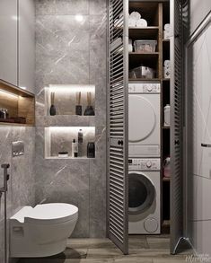 a bathroom with a toilet, washer and dryer inside of it next to a walk in closet