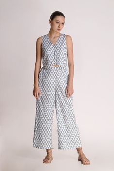 This white printed motif pant is a love story that blossoms sophistication with a tinge of charm. The relaxed fit of the pants gives a fresh look to the small motif prints on display. Mindfully crafted from cotton, it's like a superhero for the summer, ready to rescue you from sweat and stickiness. Rock this look with the Aster Printed Motif top & classy shoes or stilettos, and let the flower power spread its magic wherever you go! Material: CottonStyle/Print: Small Motif Handblock PrintPant Len Blue Lily, Classy Shoes, A Love Story, Fabric Covered Button, Floral Scarf, Midi Shirt Dress, Fresh Look, Summer Ready, Printed Pants