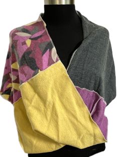 "Perfect for fall and winter! This beautiful piece is a cross between a scarf and a poncho...it pulls over the head like a poncho (but has a larger opening and won't mess up your hair), and it has a stylish twist in the front like a scarf. This warm wrap is made entirely from recycled wool sweaters. It can be worn as outerwear, or as a \"topper\" to complement your outfit. There is a point in the back and a twist in the front for visual interest.  Of course, it can be turned in any direction you Recycled Wool Sweater, Orchid Purple, Ladies Poncho, Wool Poncho, Mess Up, Fall And Winter, Ponchos, Wool Sweaters, Charcoal Grey