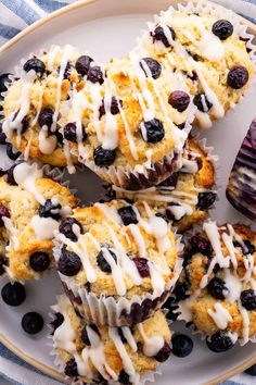 blueberry muffins with icing on a plate