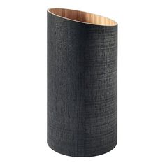 a black vase with wooden sides on a white background