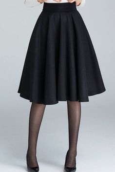 Black A-line Voluminous Skirt, Black Voluminous A-line Skirt, Fall Stretch A-line Skirt, Classic Black A-line Skirt, Classic Knee-length Party Skirt, Classic Knee-length Skirt For Party, Classic Knee-length Gathered Skirt, Fall Stretch A-line Pleated Skirt, Winter Solid Color Full Skirt