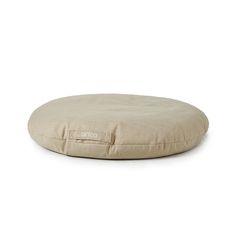 a round dog bed on a white background