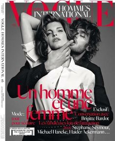 a man kissing a woman on the cover of a magazine