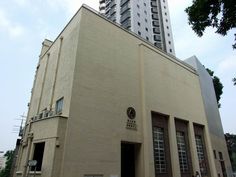 a tall building sitting next to a parking lot