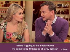 a man and woman sitting next to each other in front of shelves with baby products