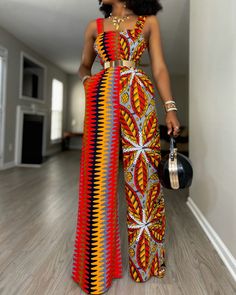 a woman standing in a room wearing a colorful dress