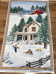 a quilt with a painting of a house and trees in the snow next to a fence